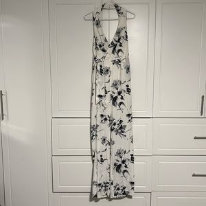 Lightly worn cream w/ charcoal flowers halter jumpsuit. Open back. Size XL.